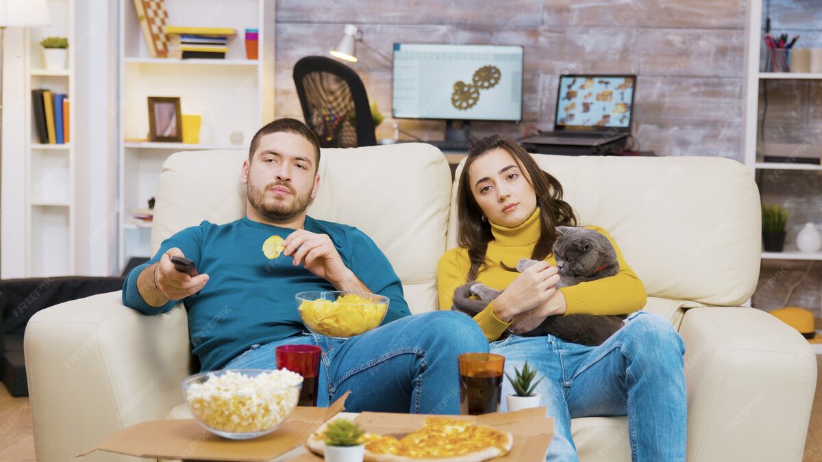 Couple relaxing with IPTV entertainment